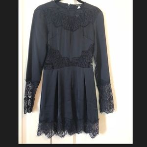 Never worn, navy romper with lace detail